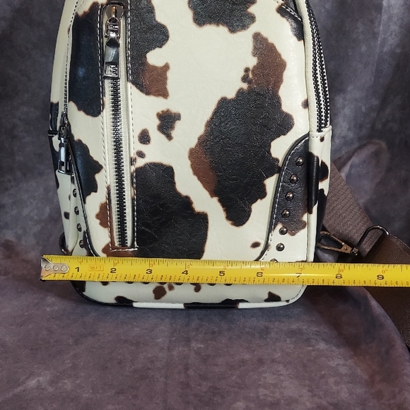 LNWOT Sam and Hadley Studded Cow Print Sling Backpack Faux Leather Brown White